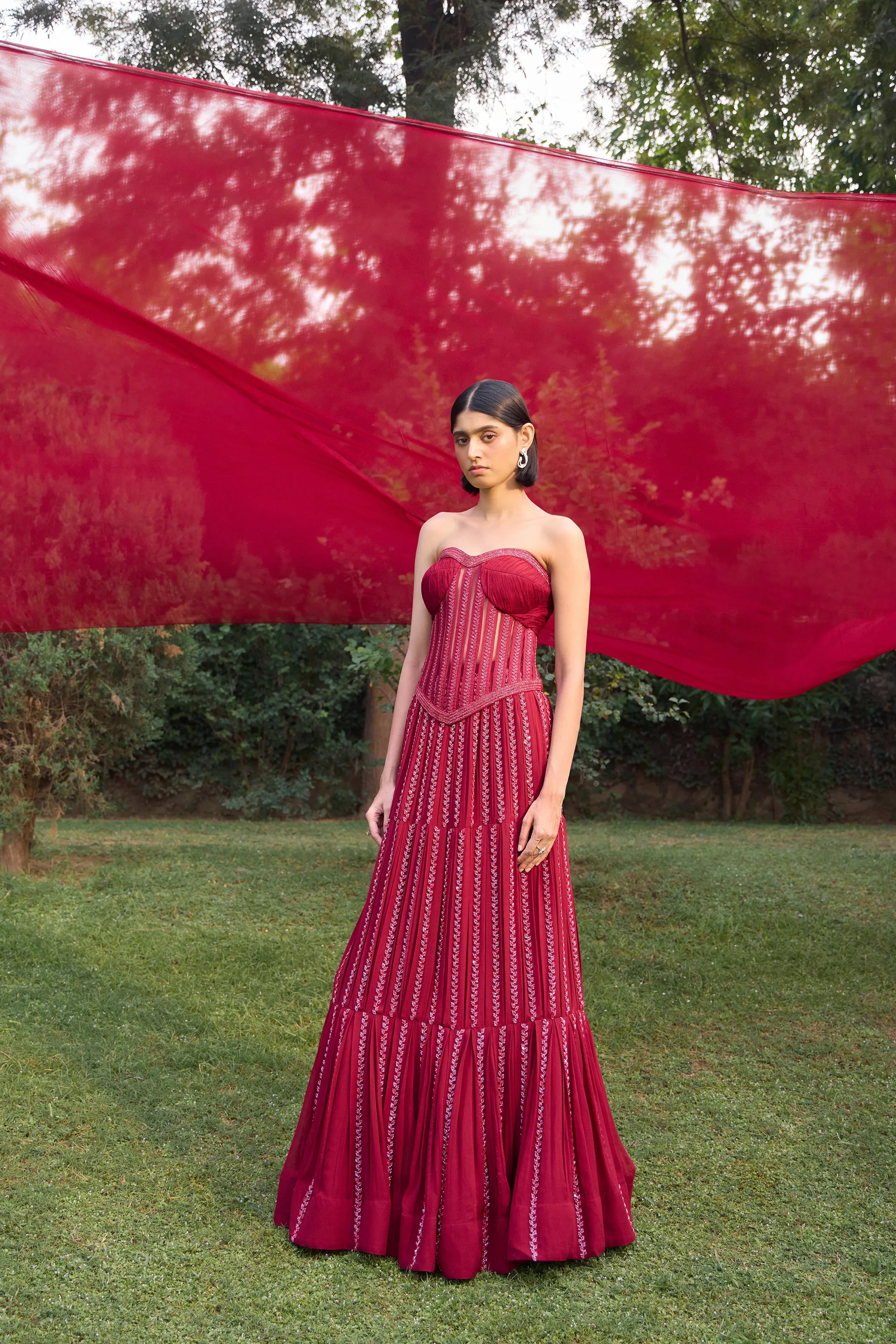 Ruby Red Corset With Box Pleat Lehenga - Radhika Soni